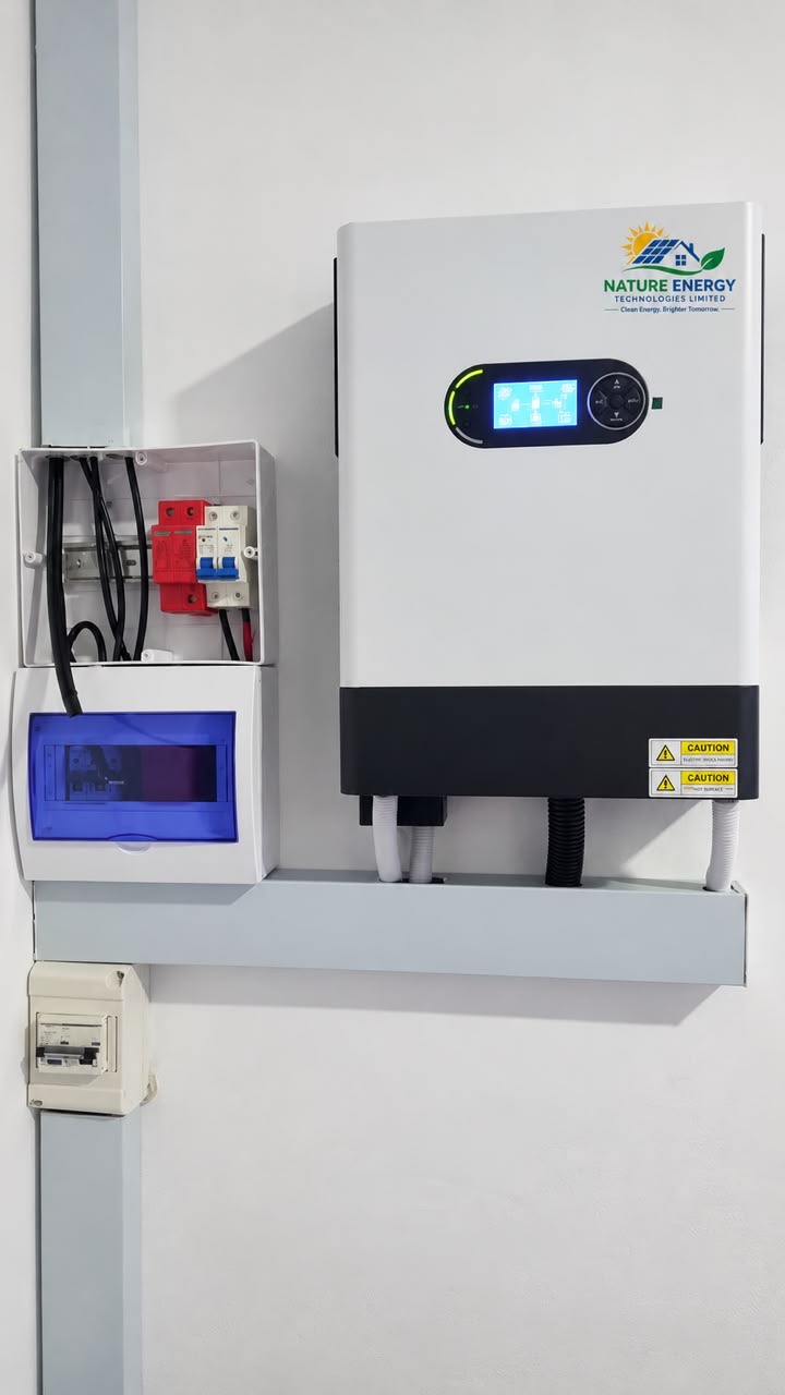 Wall-mounted hybrid inverter with a distribution board beside it